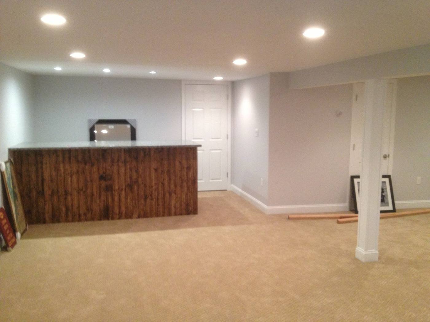 Finished basement with wood-front bar and living space