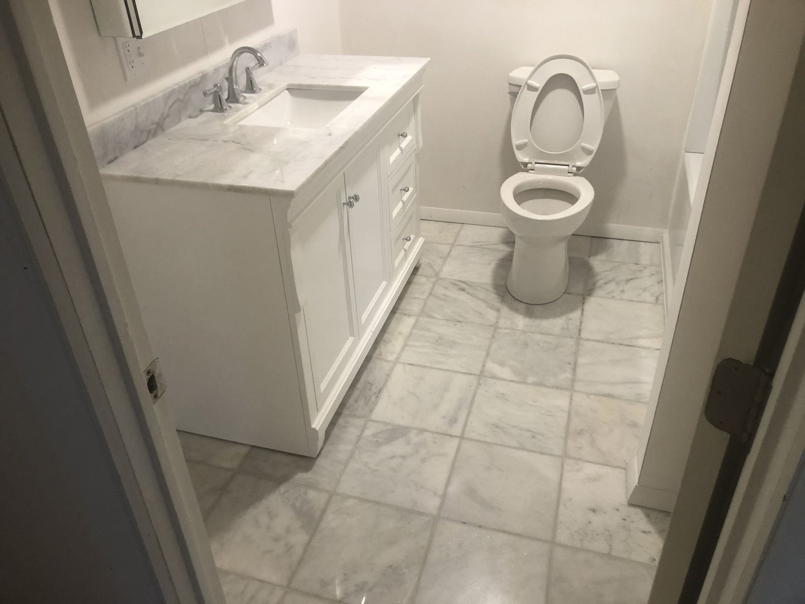 Vanity with marble floor tile