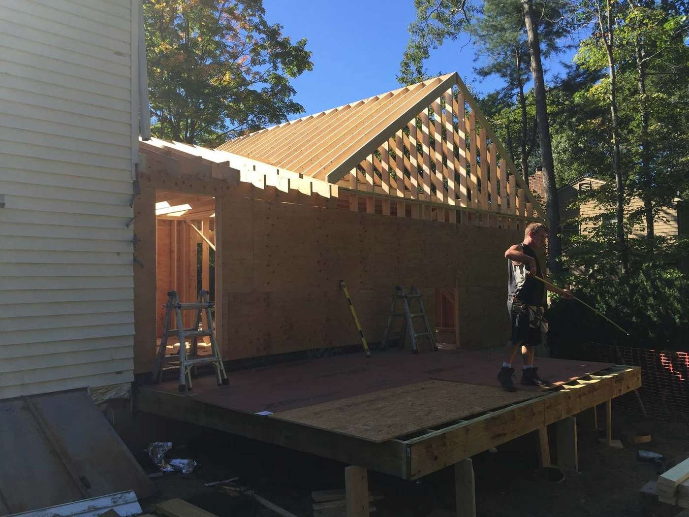 Roof sheathing going on over the framed garage