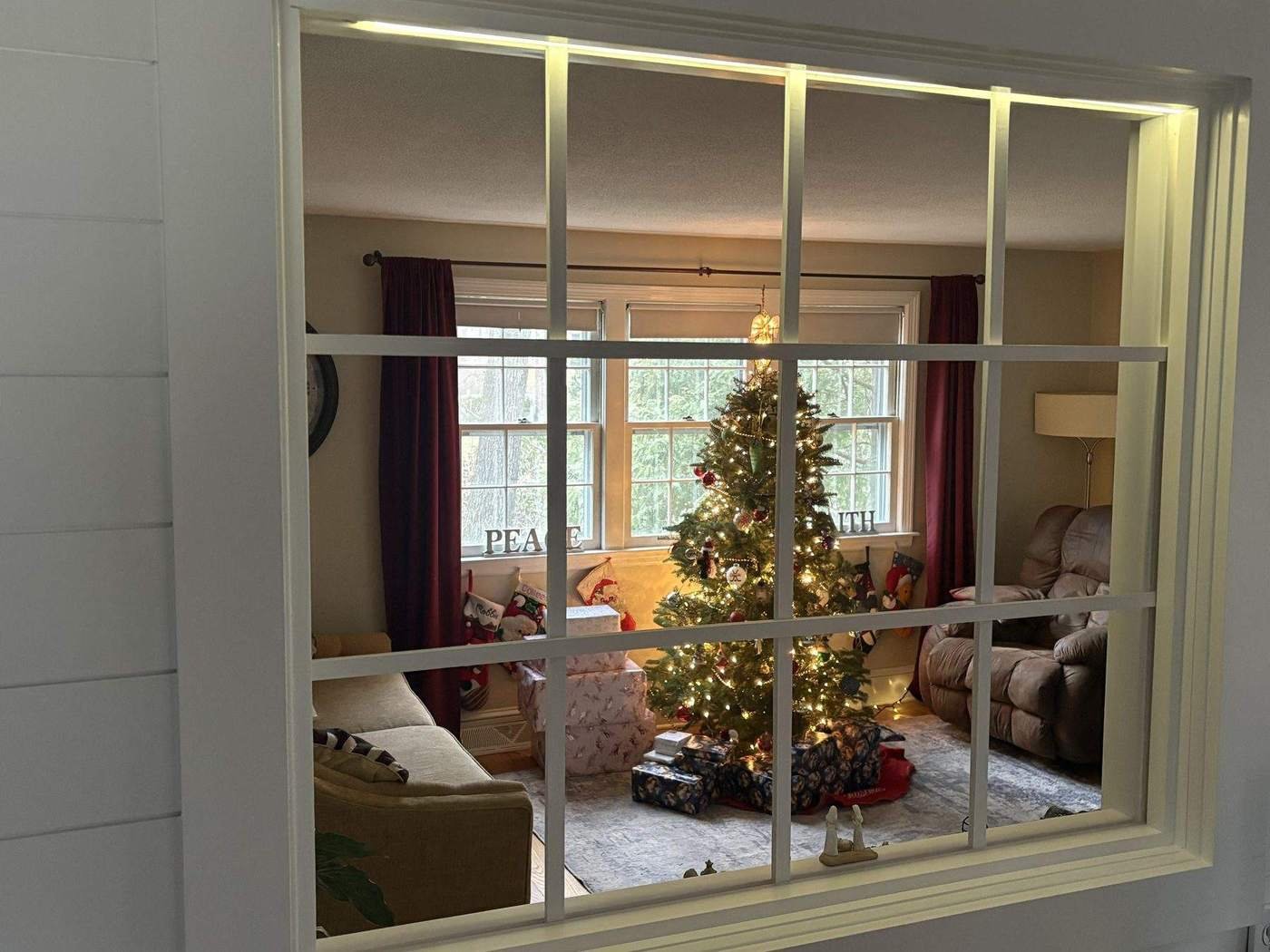 Interior glazed window wall between two rooms