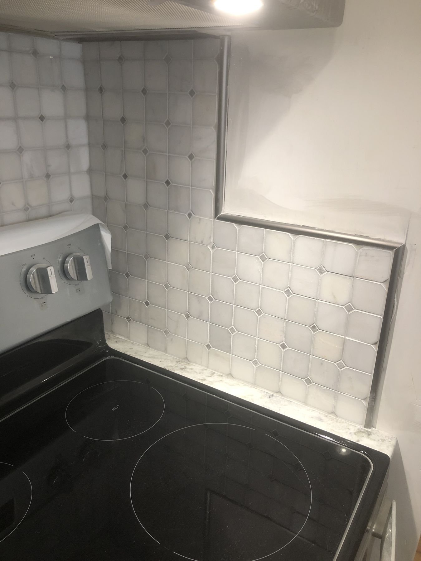 Tile backsplash in progress