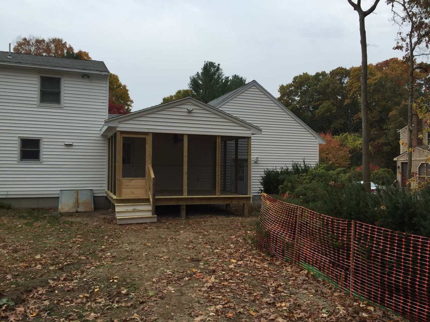 Screened porch from the yard alongside the house