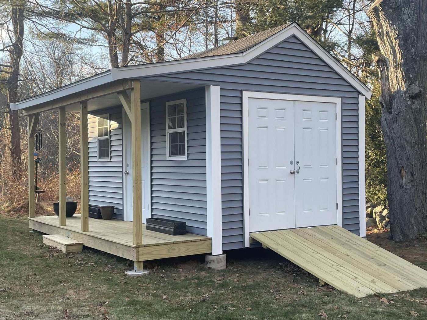 Finished outbuilding with double doors and ramp
