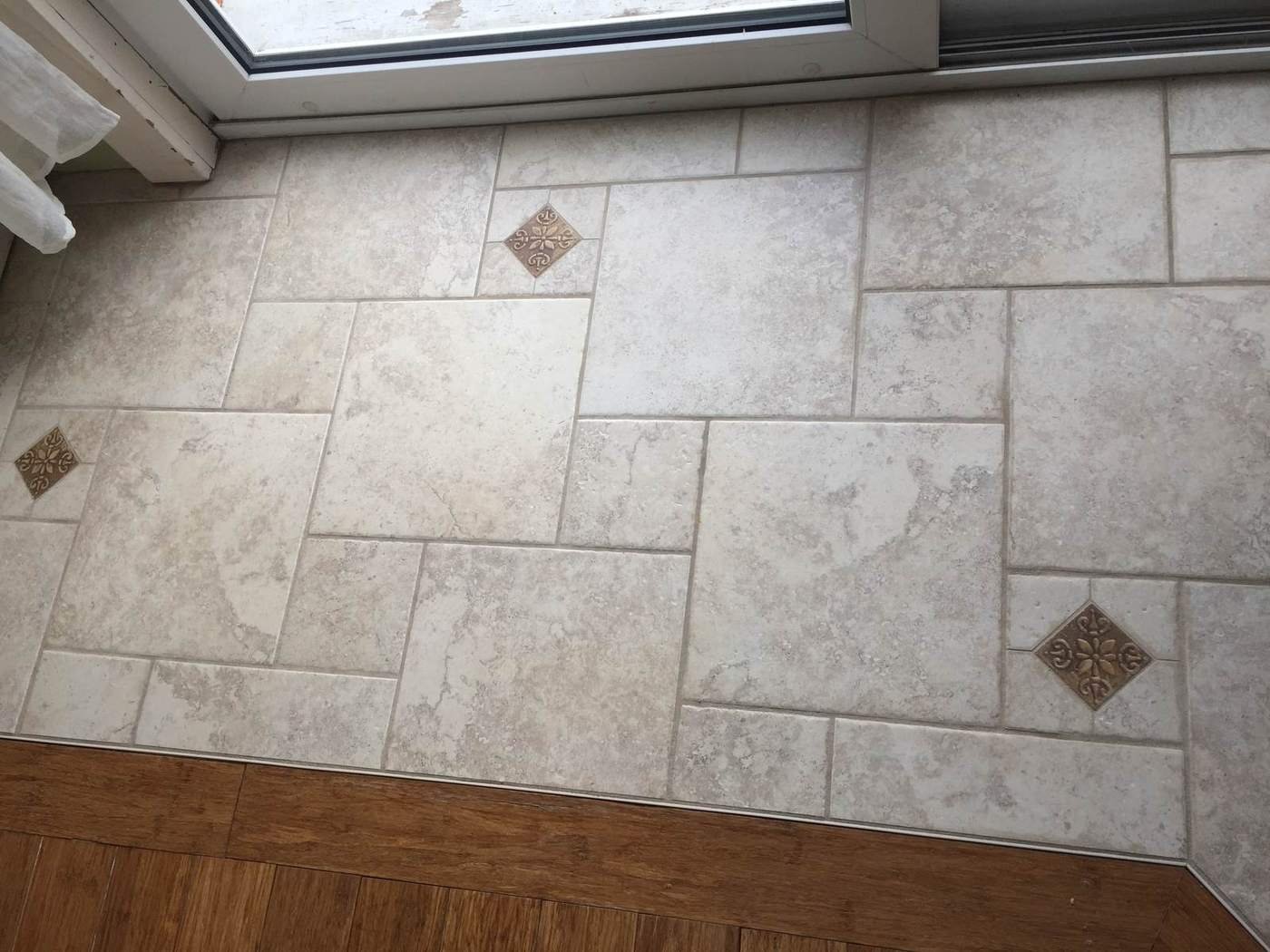 Custom tile floor pattern meeting hardwood