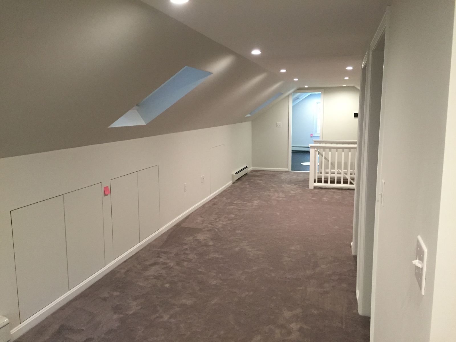 Finished second floor with skylight and sloped ceilings